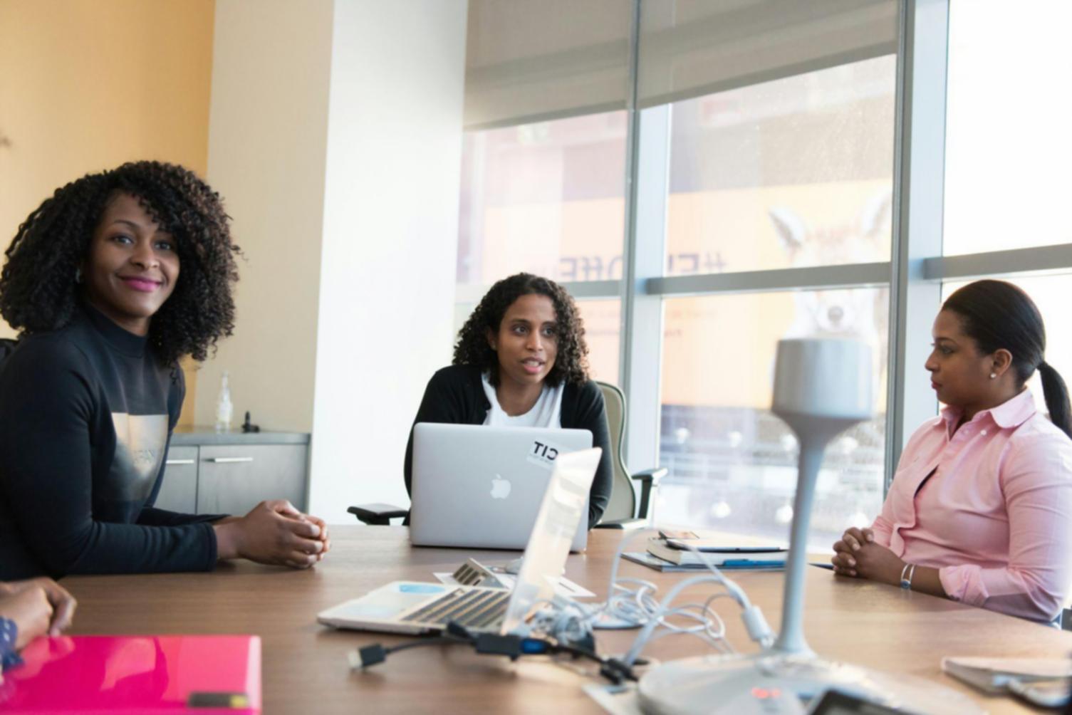 Investment professionals conducting interactive webinar session with real-time market analysis